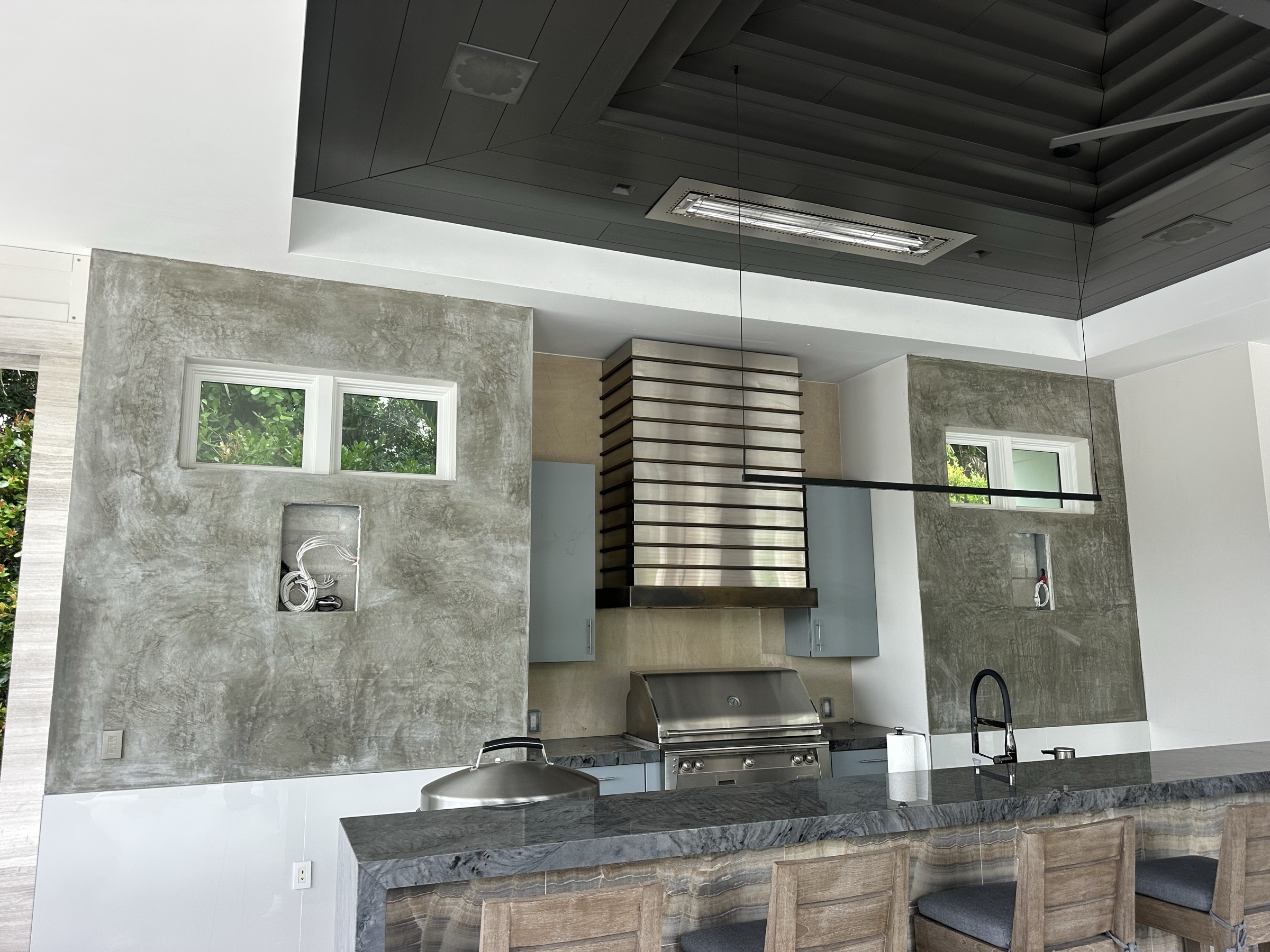 Custom stucco outdoor kitchen with column finish in Naples, FL